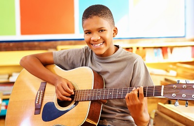 child playing the guitar